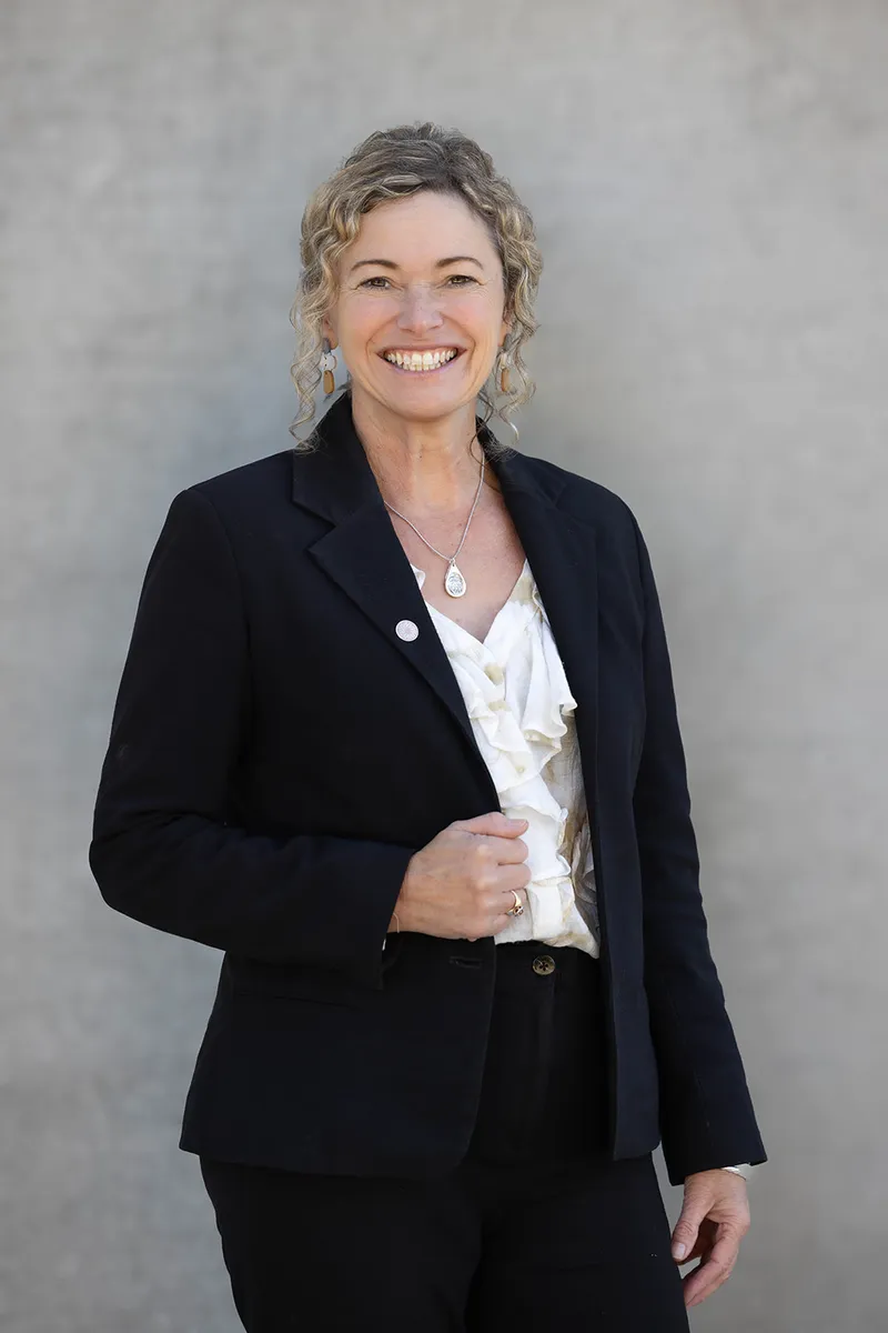 Business owner smiling in a natural branding portrait