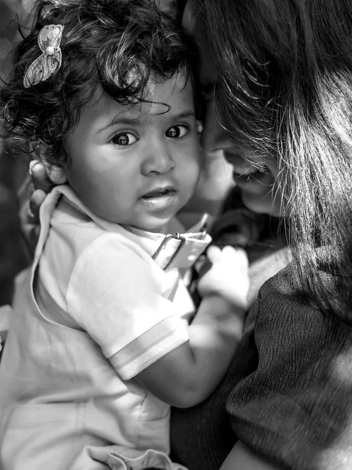 Mother holding her daughter, Eye Photography family portfolio