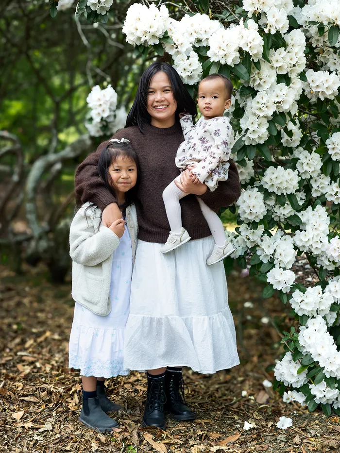 Mother with her two children among spring blossom, Eye Photography family portfolio